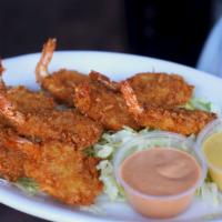 Coconut Shrimp · Fried coconut breaded shrimp served with honey mustard sauce and spicy sauce.