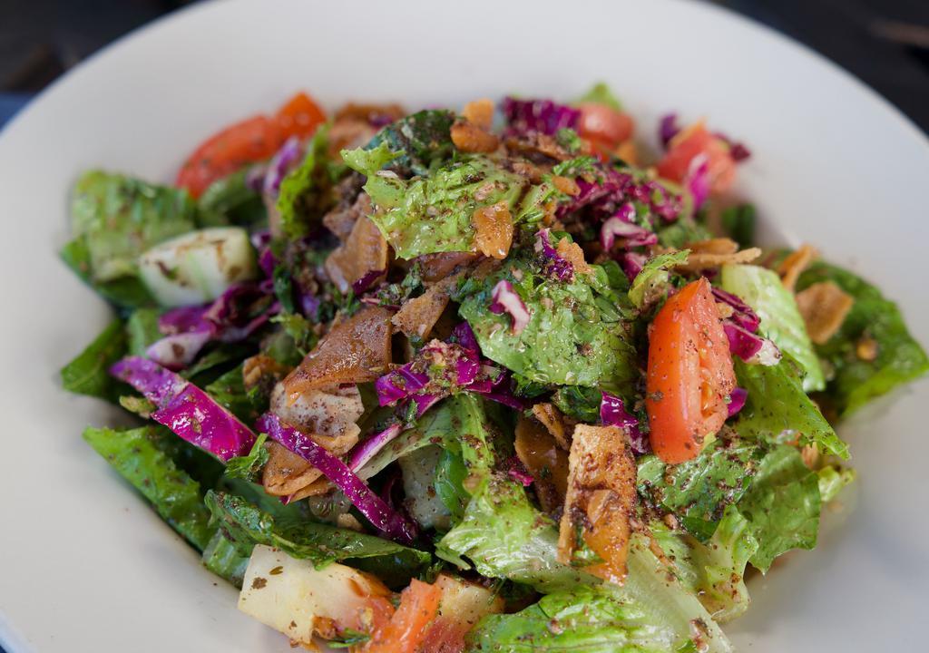 Lava Too Fattoush · Romaine lettuce tossed in our special homemade fattoush dressing with tomatoes, cucumber and fried pita chips.
