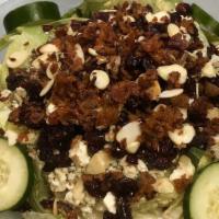 Michigan Vineyard Salad · Fresh greens, crumbled bleu cheese, chopped mixed nuts, bacon, tomatoes, cucumbers, and drie...