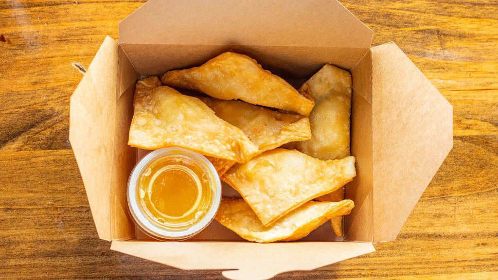 Crab Rangoon · (6) Giant deep-fried wontons filled with a mixture of crab meat and cream cheese, served with homemade sweet peach sauce.