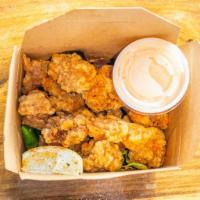 Chicken Karaage · Crispy nuggets; finished with lime and togarashi, served with homemade Yum Yum Sauce on the ...