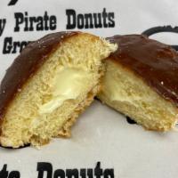 Chocolate Frosted Custard Filled Yeast Donut · Yeast donut filled with Bavarian cream/custard (yellow pudding) topped with chocolate icing