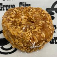 Toasted Coconut Cake Donut · Cake donut dipped in glaze and rolled in toasted coconut