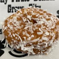 White Coconut Cake Donut · Cake donut dipped in glaze and rolled in white coconut