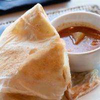 001 Roti Canai · All-time Malaysian favorite. come with chicken potato curry sauce.