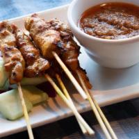 004 Satay Chicken · Grilled marinated chicken (dark meat) on skewers with spicy peanut dipping sauce