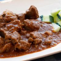 050 Beef Rendang · Spicy: Sharp, fiery taste. Beef and tendons simmered in coconut milk with chilies and spices...