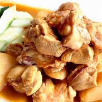 052 Kari Chicken · Spicy: Sharp, fiery taste. Chicken (bones in) and potatoes simmered in a mild coconut red cu...