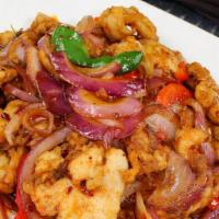  076 Spicy Basil Chicken · Spicy: Sharp, fiery taste. Chicken stir-fried with onions, bell peppers, and fresh basil lea...
