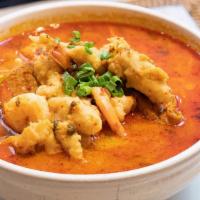 163 Nyonya Laksa · Spicy: Sharp, fiery taste. Malacca's popular spicy coconut soup served with yellow noodles, ...