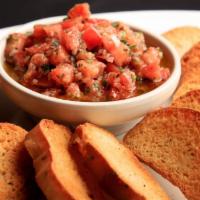 Bruschetta Appetizer · Roma tomatoes, olive oil, garlic and spices with toasted crostini.