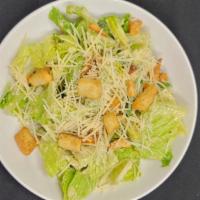 Caesar Salad · Topped with Parmesan cheese, garlic croutons & our house made caesar dressing.