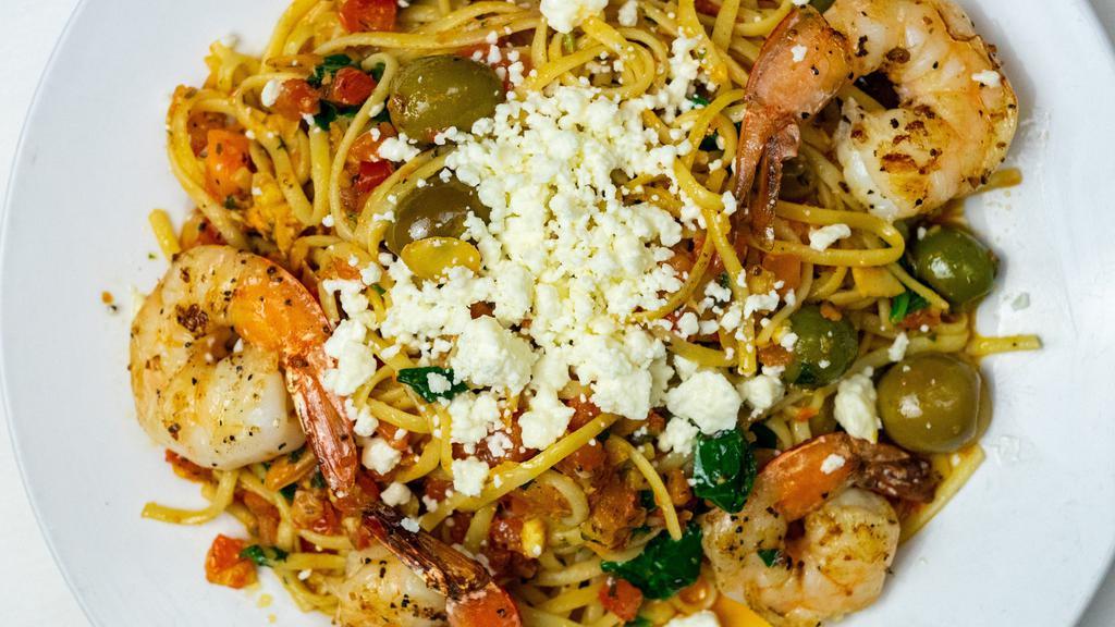 Greek Pasta · Linguini, sauteed in olive oil with spinach, bruschetta and Greek olives, topped with almonds, feta cheese & a hint of sun-dried tomato pesto