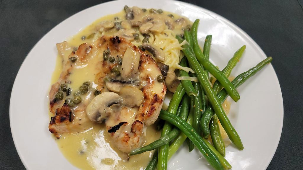 Piccata Di Pollo · Grilled chicken breast, served with capers, mushrooms and in our lemon butter garlic sauce.