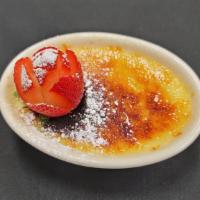 Crème Brule · Baked vanilla custard topped with caramelized sugar