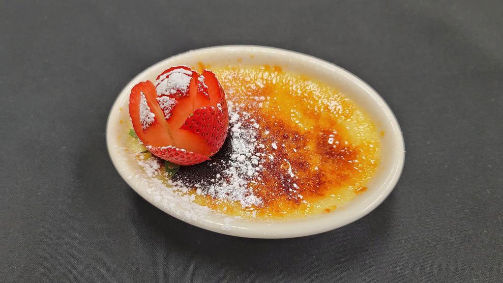 Crème Brule · Baked vanilla custard topped with caramelized sugar