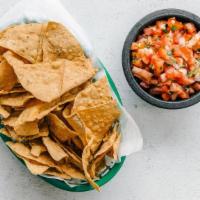 Chips & Pico De Gallo · 100% corn tortilla chips served with a chunky salsa consisting of tomatoes, cilantro, lime j...