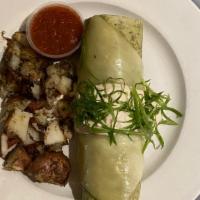 Breakfast Burrito · spinach tortilla filled with guacamole & scrambled eggs topped with melted jack cheese & anc...