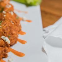 Buffalo Shrimp · Buffalo sauce, celery and carrots, blue cheese crumbles, ranch.