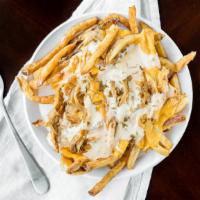 Animal Hand Cut Fries · Animal sauce and caramelized onions and american cheese.