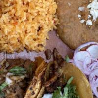 Flour Taco Dinner · Three flour tacos with your choice of meat. Served with rice and beans, lettuce, tomatoes on...