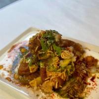 Aloo Tikki Chaat · Potato patty with herbs prepared North Indian style Topped with mint chutney  ,tamarind chut...