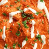 Chicken Makhani · Boneless tandoori cooked in appetizing tomato and butter sauce with crushed cashews.