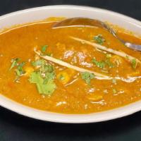 Chicken Curry · Chicken cooked with spices in a thick curry sauce.