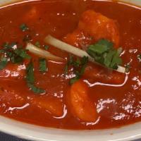 Shrimp Vindaloo · Shrimp cooked in hot and spicy sauce with potatoes.