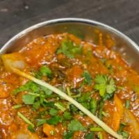 Kadhai Paneer · Cottage cheese cooked with onion and tomatoes blended in creamy hot sauce with Indian spices.