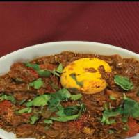 Murgi Massala · Marinated grilled chicken (with bone) cooked with lamb mince meat and boiled egg.