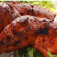 Tandoori Chicken (Half) · Marinated in tandoori sauce with herbs, ginger, garlic and homemade yoghurt, grilled in the ...