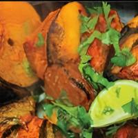 Chicken Shashlik · Marinated spring chicken skewered with onion, green peppers, tomatoes and grilled in tandoor...