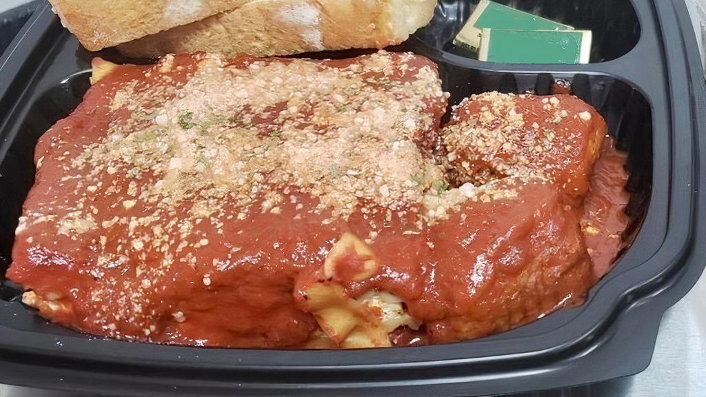 Cheese Lasagna · Our signature family recipe since 1935. With rich ricotta cheese and layered between al dente lasagna noodles and topped with homemade spaghetti sauce, served with 2 meatballs and sliced Italian bread& butter. You can Substitute meatballs for an additional charge, see 