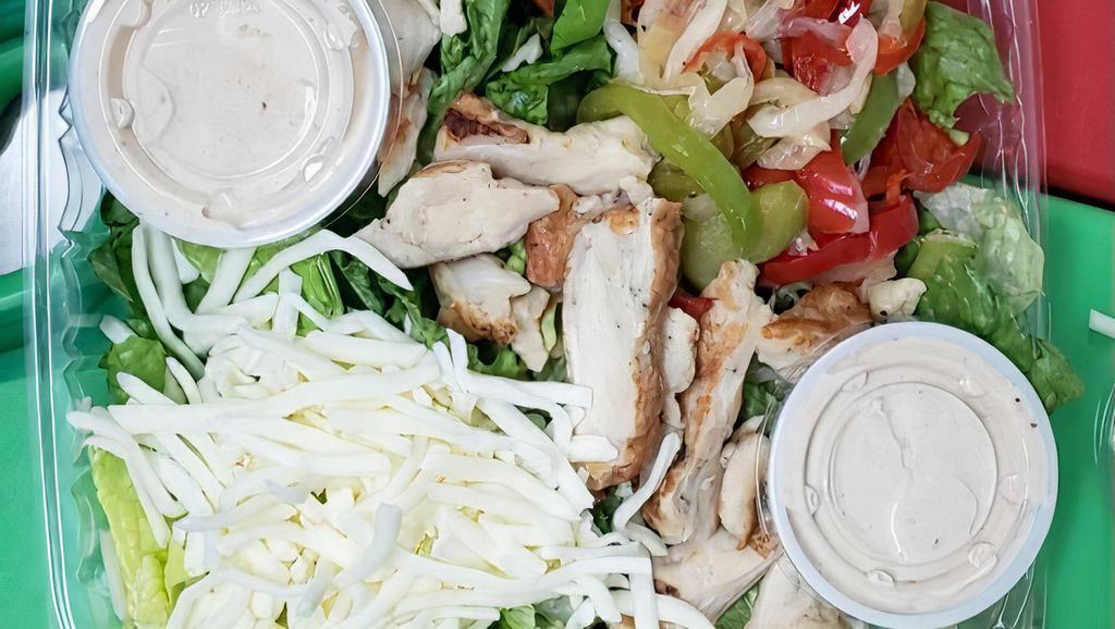 Fajita Chicken Salad · Love fajitas, but not the calories? This Fajita Salad is for you. Fresh lettuce, corn, olives, chicken, tomatoes, red onions and peppers make it hearty enough for a main dish, but light enough that it's still healthy.
