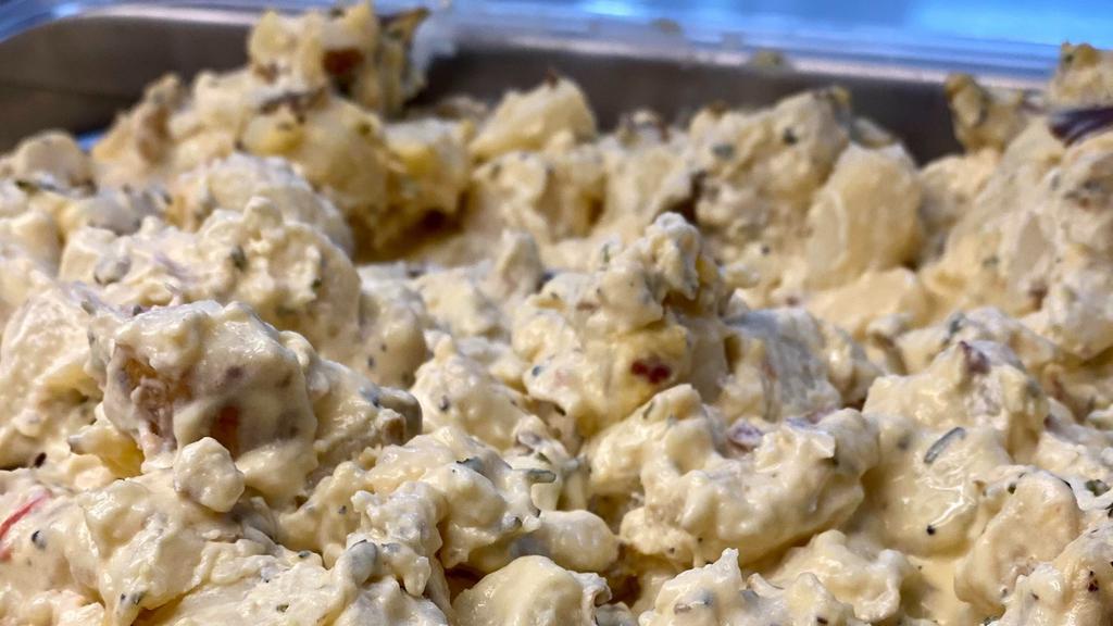 Baked Potato Salad · Our Loaded Baked Potato Salad is packed with soft red potatoes, crispy bacon, fresh green onions, shredded cheddar cheese, and mayo.