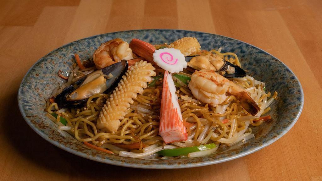 Seafood Stir-Fry Ramen /  シーフードラーメン炒め · Boiled Ramen Stir-Fry With Shrimp, Mussel, Squid, Crab Meat, Fish Cake, Bean Sprouts, Carrots, Green Peppers, Topped With Rice Seasonings.