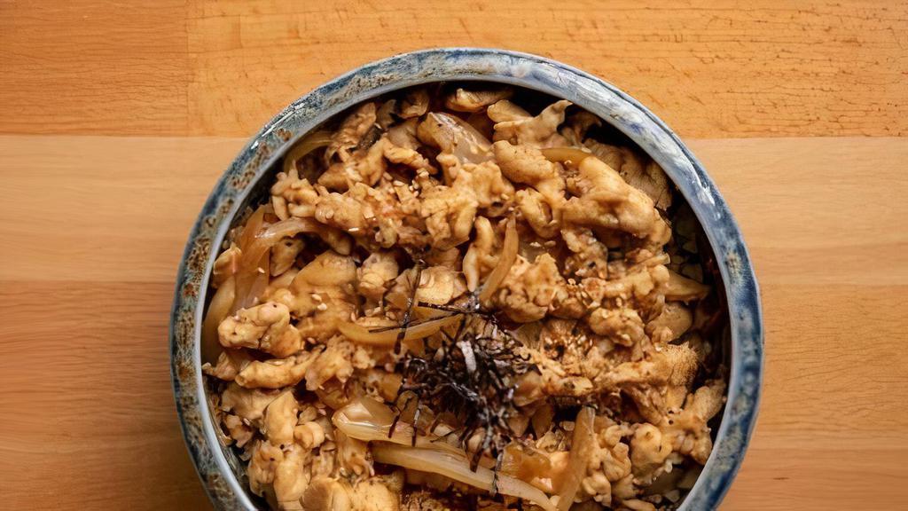 Chicken Donburi · Sliced Chicken & Onion Simmered In Chef Special Sauce Over White Rice Topped With Rice Seasoning And Nori.