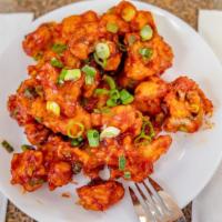 Gobi Manchurian · Cauliflower pieces battered, sautéed with green onions, spices and tossed with sauces.