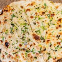Garlic Naan · Naan covered with chopped garlic and baked in clay oven.