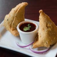 Vegetable Samosa · 2 pieces crispy fried dumplings stuffed with potatoes and vegetables served with chutney. Ve...