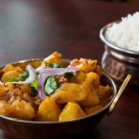 Aloo Gobi · Potatoes and cauliflower toasted with ginger and freshly ground spices. Served with basmati ...