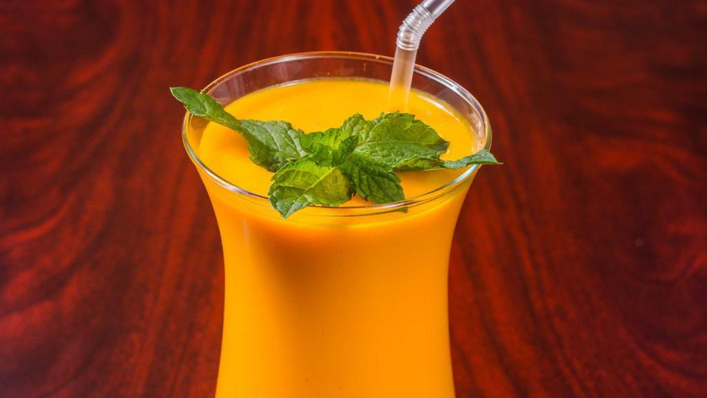 Mango Lassi · Churned yogurt with mango puree served chilled. Dairy-free.