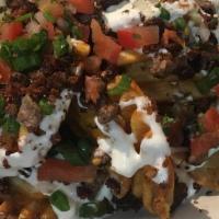 Asada Fries · Our Famous fries topped with queso blanco, Asada steak, and pico de gallo.