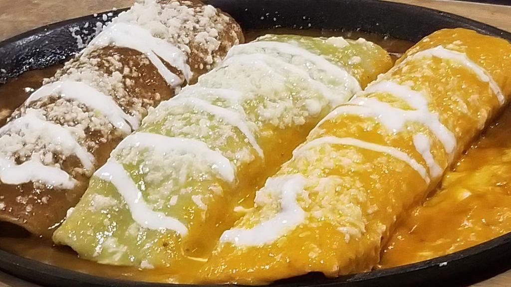 Enchiladas Tres Amigos (3) · 3 pieces. Mole, suiza, and ranchera enchiladas. Corn tortillas stuffed with cheese and your choice of meat and covered with salsa.