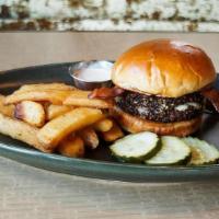 Peppered Bleuyah Burger · Black pepper-crusted burger* stuffed with bleu cheese, sherried onions, and crispy bacon on ...