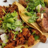 Street Tacos · Three grilled steak, chicken, al pastor (pork tacos marinated in our pineapple sauce cooked ...