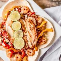Seafood Alambre · Grilled scallops, shrimp and tilapia.