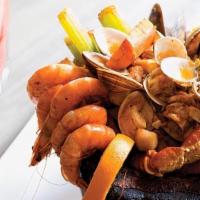 Molcajete Marinero · A savory mix of shrimp, mussels, surimi, abalone, clams and crab legs cooked with our delici...