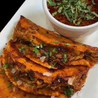 Quesabirria · Three corn tortilla, melted cheese guajillo - braised beef short rib meat, onion, cilantro w...
